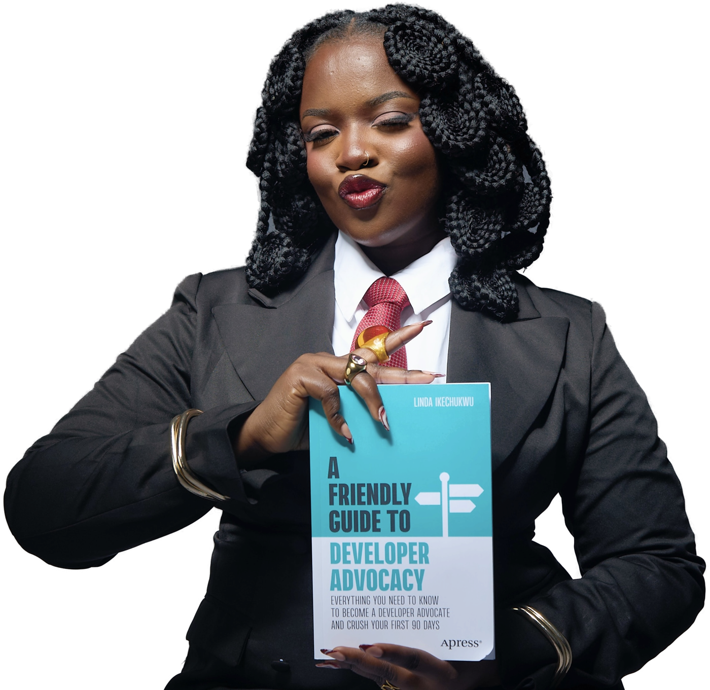 Linda Ikechukwu holding A Friendly Guide to Developer Advocacy